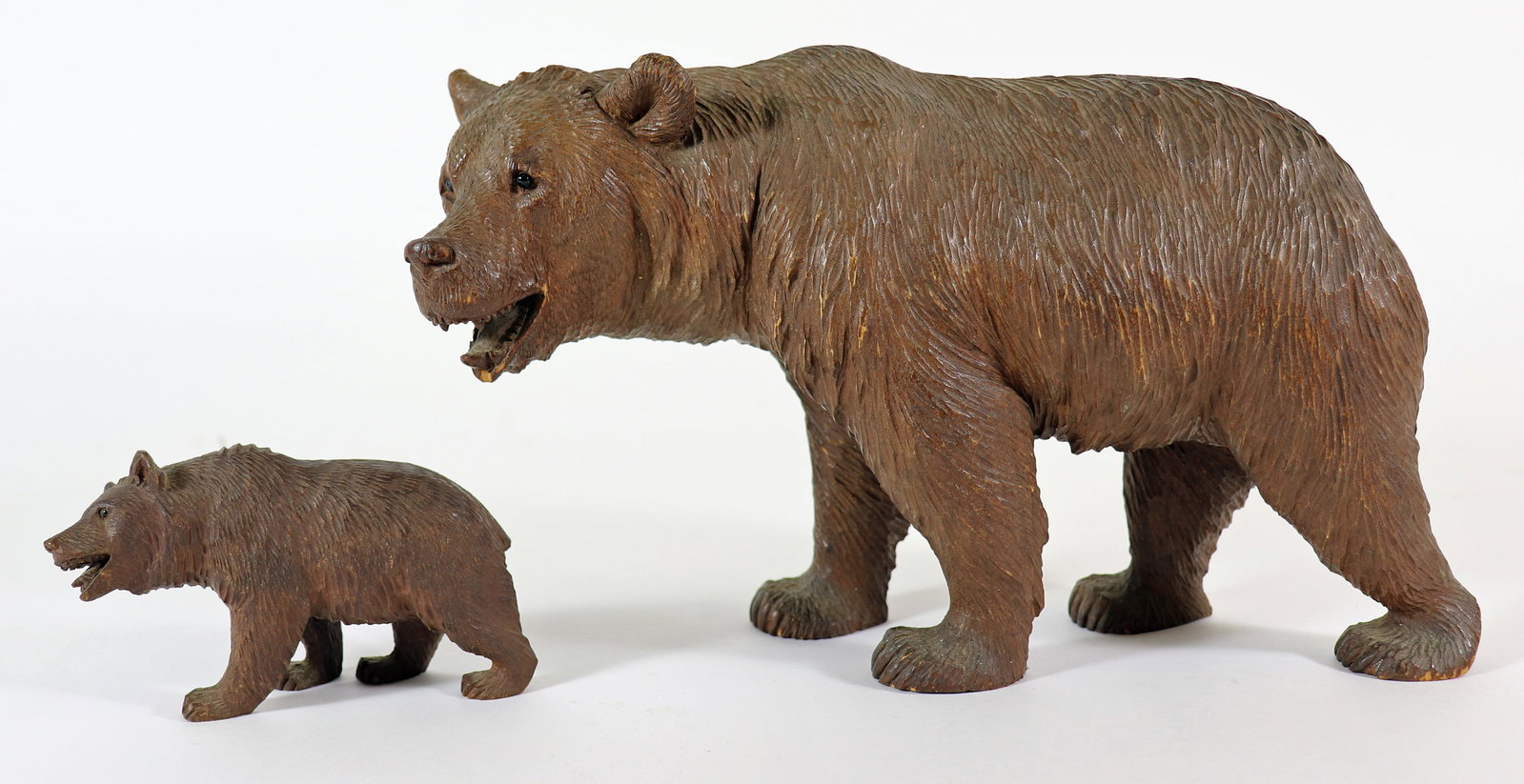 (2) BLACK FOREST MOTHER & BABY BEAR: Pair of old Black Forest carved wood bears Very detailed, down to the teeth and eyes. 4 1/2" to 11" long