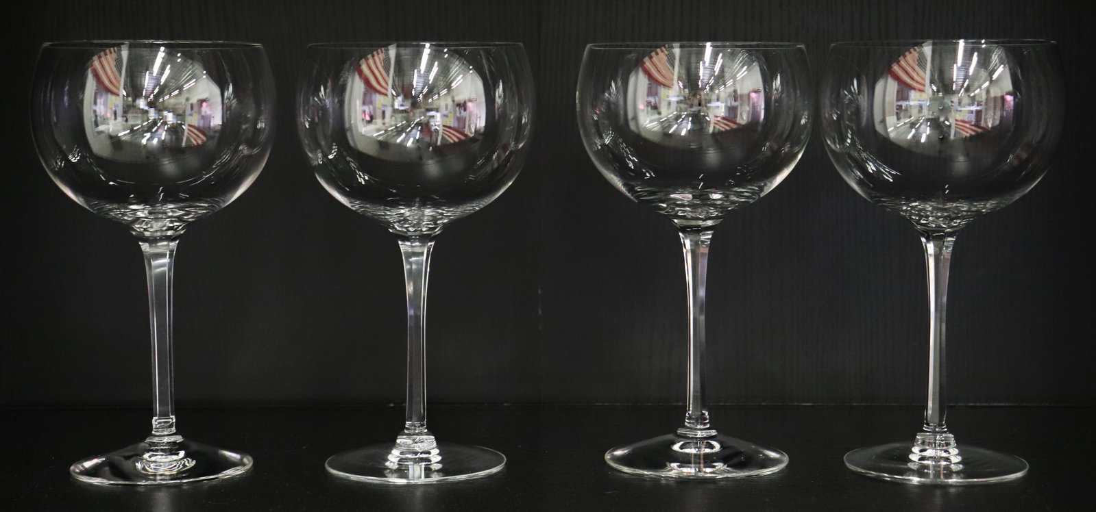 (4) CARTIER WINE STEMS: Set of 4 Cartier signed wine glasses 7" tall.