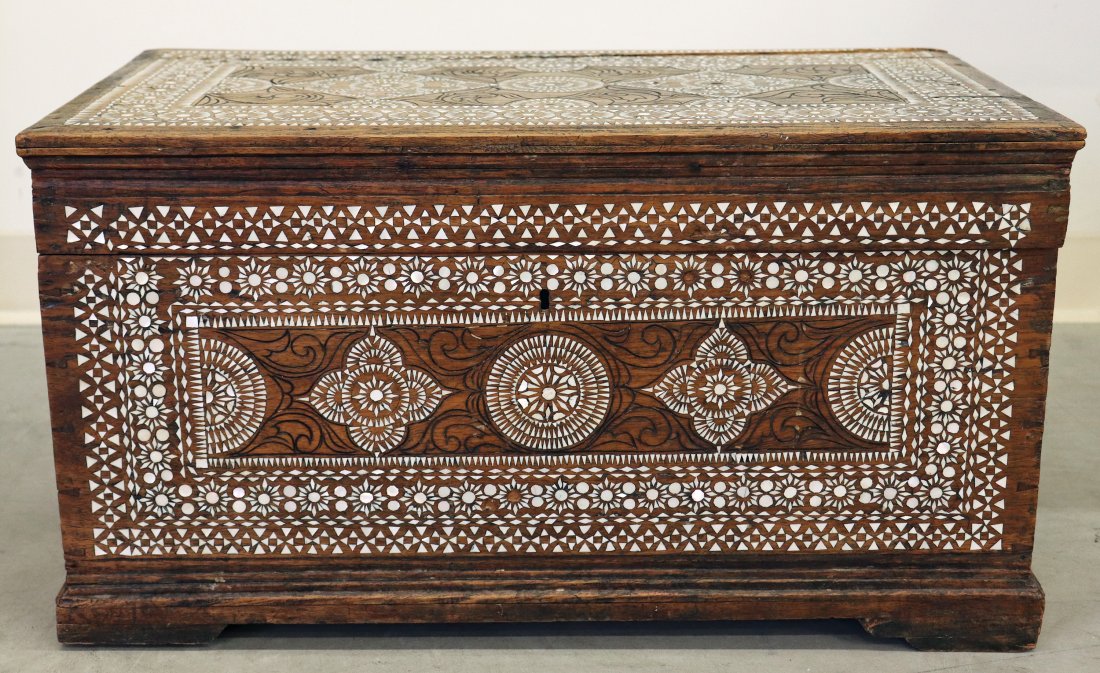 INDONESIAN MOTHER OF PEARL INLAID CHEST: Indonesian / Moroccan mother of pearl inlaid wood trunk. Age related wear, split to top. Measures 26" x 15" wide 14.5" tall.