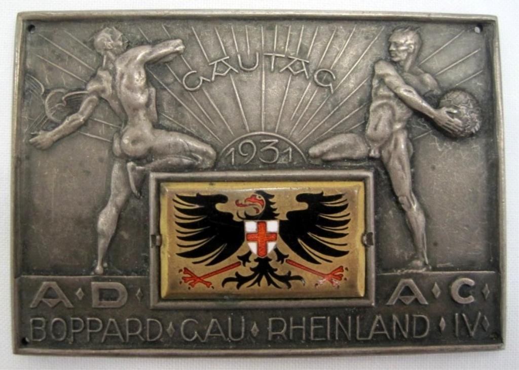 ALL GERMAN AUTO CLUB GAU RHINELAND RALLY PLAQUE: 1931 Bronze A.D.A.C. Allgemeine Deutsche Auto Club. Reverse marked Adam Donner Elbertfeld. Golden insert w/ Enamel Eagle Crest. Measures 3 3/4" x 2 1/2"