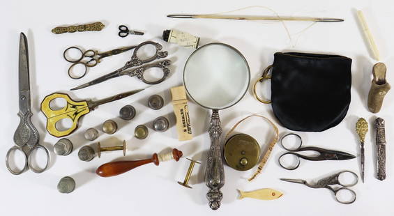 ANTIQUE VICTORIAN SEWING SCISSORS, THIMBLES & MORE: A collection of antique sewing notions to include a sterling silver magnifying glass, needle etui, scissors to include a Jamestown Exposition scissors, thimbles and much more.