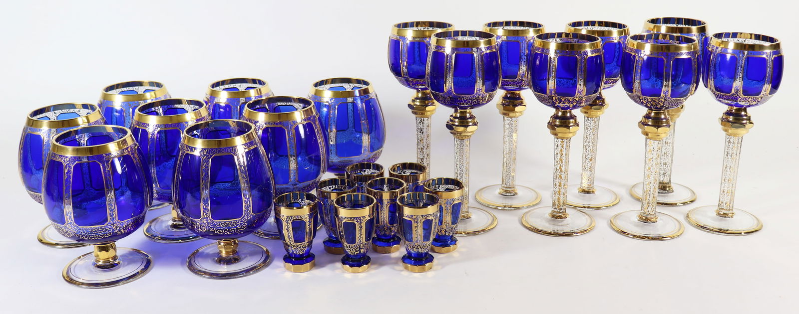 (24) MOSER COBALT WINE, BRANDY, CORDIAL GLASSES: A set of stemware including (8) wine hocks 8 1/4", (8) brandy snifter glasses and (8) cordial glasses. Cobalt blue with 22K gold trim. Unmarked, attributed to Moser.