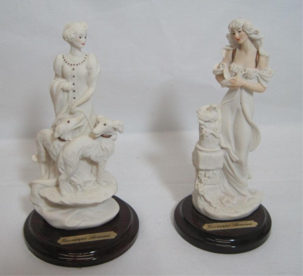 PAIR GIUSEPPE ARMANI GIFT FIGURINES: 5" Tall. Lady with doves and lady with dogs. Lady with doves has chip. Both have original boxes.