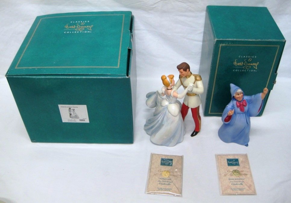 WALT DISNEY CLASSICS COLLECTION CINDERELLA FIGURES: Fairy Godmother Bibbidi Bobbidi Boo and Cinderella and Prince Charming. Both have boxes and COA. Fairy Godmother's wand is broken, pieces are included.
