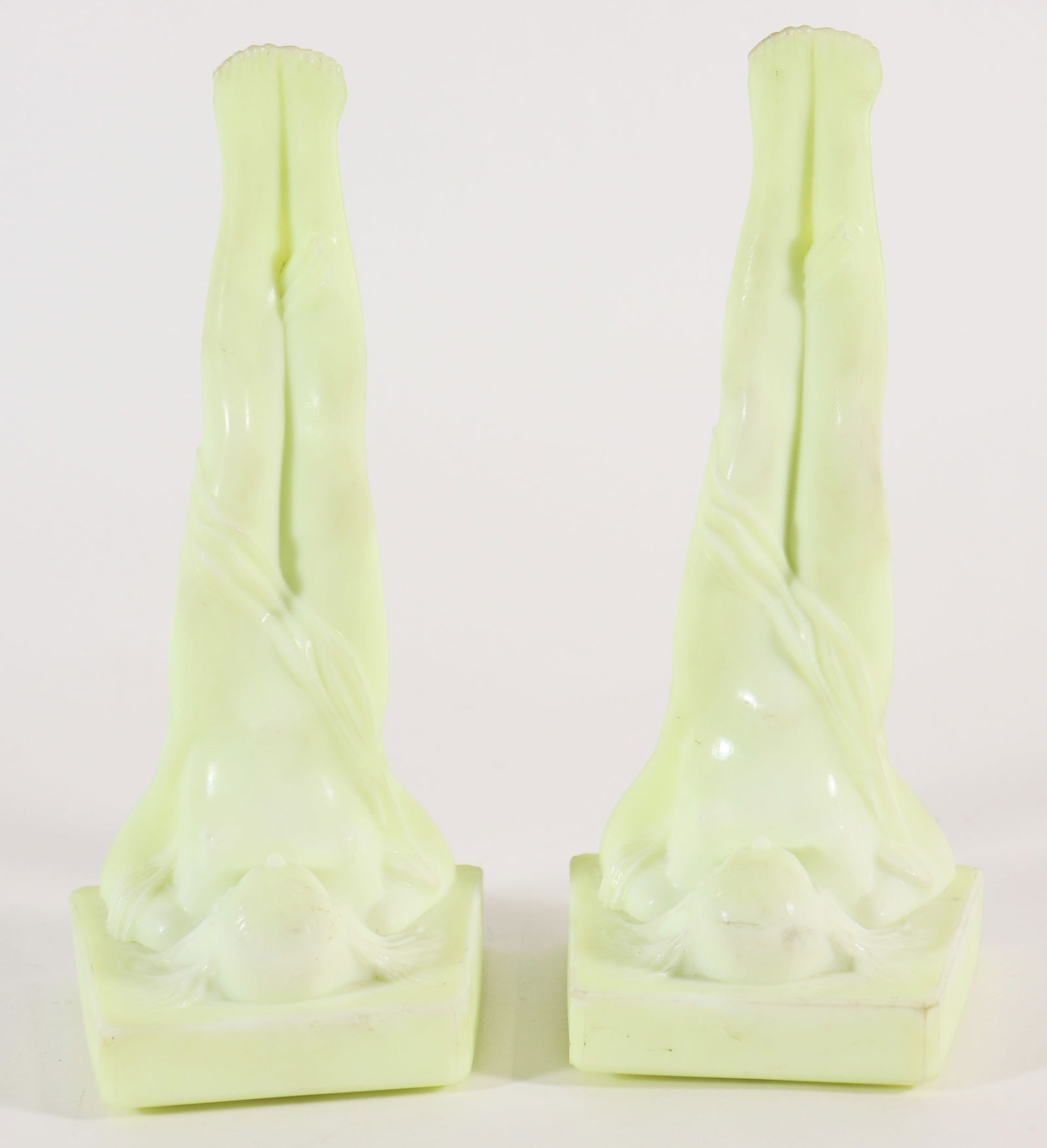 ANTIQUE URANIUM GLASS NUDE LADY BOOKENDS: A very rare pair of antique uranium glass bookends that originated in Europe in the 1800's. They are a lemon yellow custard colored glass with a nude lady reclining her legs. Similar to a Lalique desi