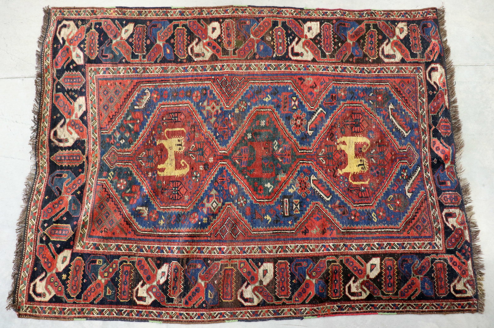 ANTIQUE PERSIAN RUG - 6' 3" x 4' 4": Antique Persian Rug with age related wear, measures 6'3" by 4'4"