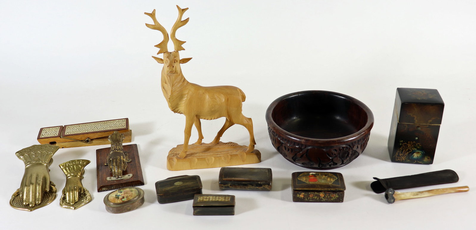 ANTIQUE SNUFF BOXES, WOOD STAG, HANDS & MORE: An assortment of items to include carved bone snuff boxes, hand painted lacquer boxes, brass memo hands and a carved wood deer stag.
