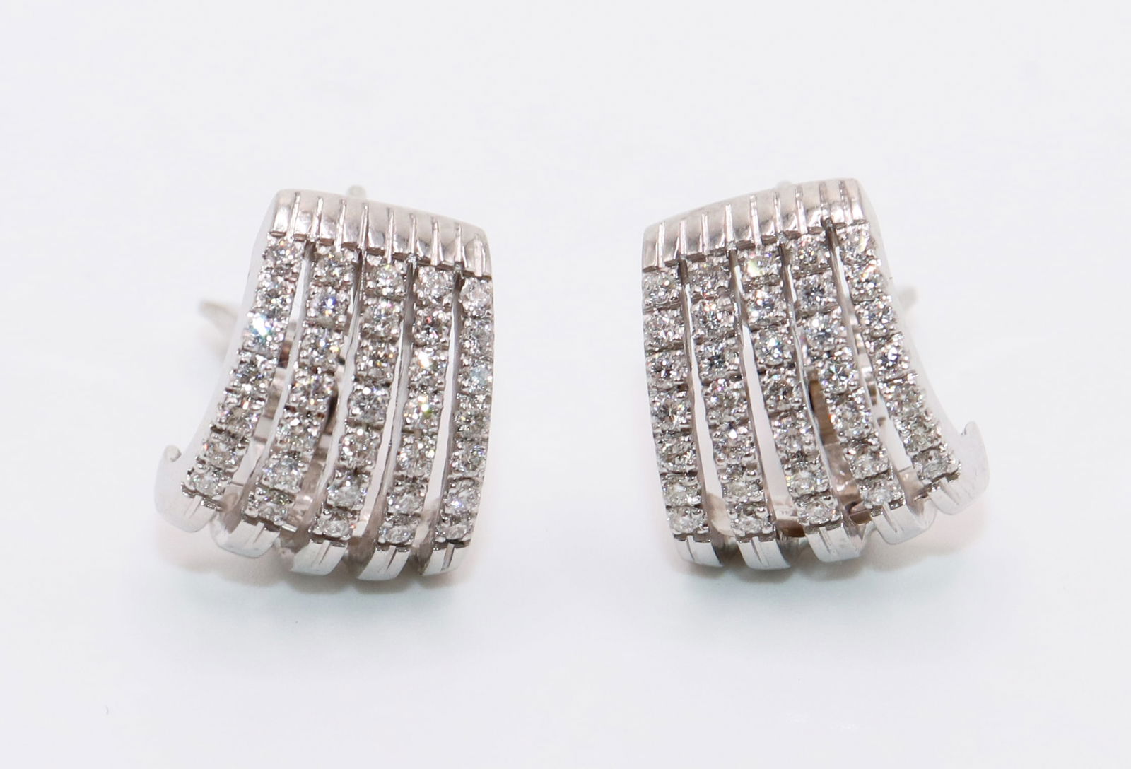 18K WHITE GOLD DIAMOND EARRINGS: 18KT white gold earrings with approximately 4.00 TCW of round diamonds. French style pierced clips. Total weight 11.2 grams, approximately 1/2" long.