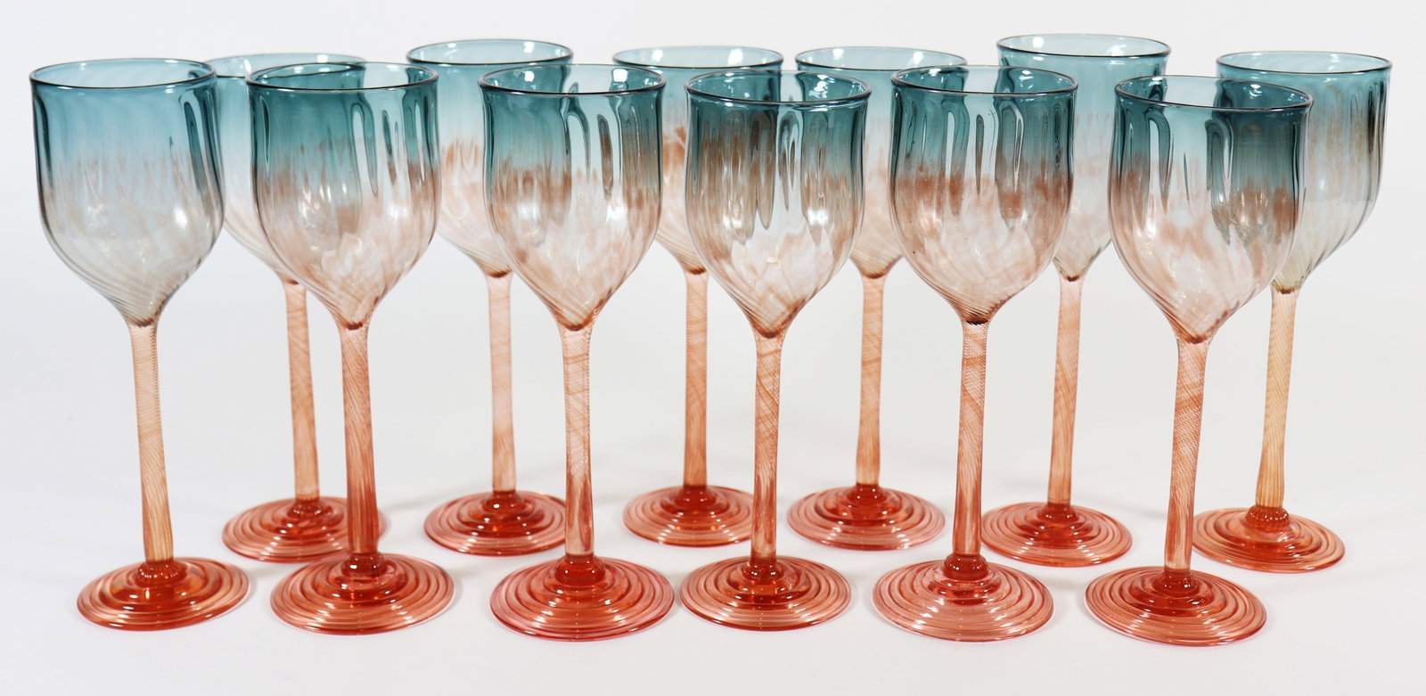 (12) ALEX BRAND SIGNED HAND BLOWN WINE GLASSES: Set of (12) hand blown art glass wine glasses. Signed on the bottom. Approximately 9" to 9.25" tall.