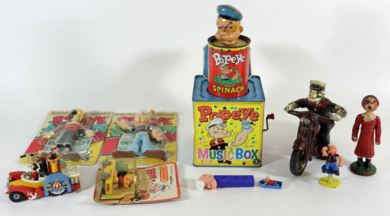 VINTAGE POPEYE COLLECTION: Includes an unopened Matchbox die cast truck, a bendable posable Popeye & Olive Oyl, a Corgi boat car, a Pez dispenser, a cast iron Olive Oyl bank, a cast iron Popeye on a motorcycle and a Popeye Spin