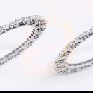 18K WHITE GOLD DIAMOND ETERNITY BAND: An 18K white gold ring with 2.70 carats of round diamonds. 4mm wide. Size 5. Weight 4.9g.