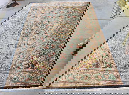 FINE QUM IRANIAN RUG SIGNED - DARK BLUE BORDER: A fine hand made Iranian Qum (Qom) silk rug measures 9' 7" by 6' 6", was displayed on a wall, little to no foot traffic. Extra photos & video of rug available per request.