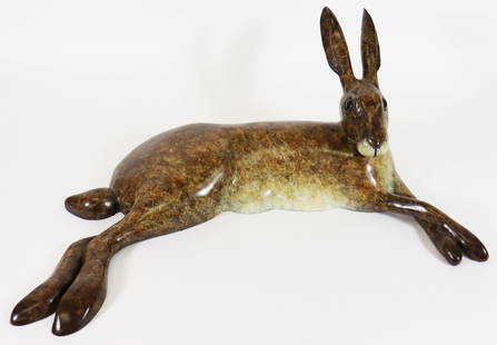 RICHARD SMITH CONTEMPORY BRONZE LYING HARE: Richard J. Smith (b. 1955) Bronze sculpture of a reclining outstretched bronze rabbit with front legs crossed in a relaxed position, ears straight up on alert. Signed by artist and numbered 19/25. Mea