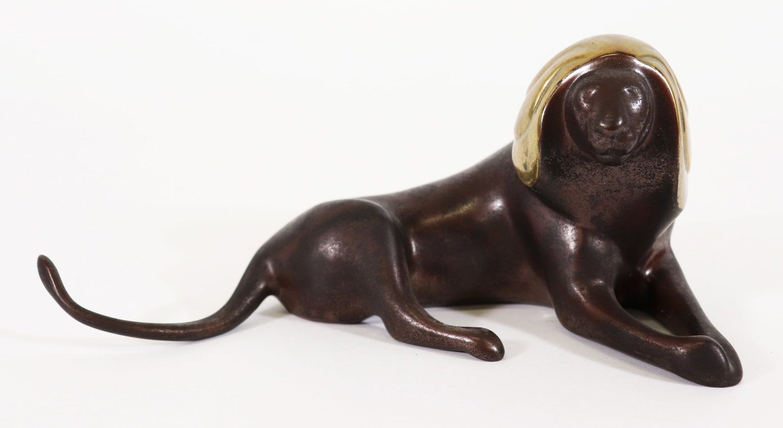 LOET VANDERVEEN BRONZE LION SCULPTURE: Loet Vanderveen (Dutch/American 1921-2015) "Resting Lion" bronze sculpture. Signed and numbered 247/750. Measures 8" x 3 1/2".