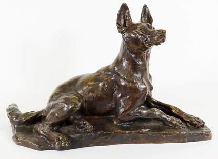 THOMAS FRANCOIS CARTIER BRONZE GERMAN SHEPARD: Thomas Francois Cartier (French 1879-1943) Bronze sculpture of a dog in a laying position with front end poised at alert with head and ears up at attention. Signed TH Cartier. Measures H 14" x W 23" x