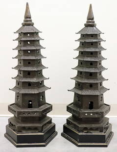 (2) TALL METAL PAGODA SCULPTURES: A pair of tall metal (bronze ?) Pagoda tiered multi-storied sculptures, symbolizing elevation and harmony. Measures 30" tall 10" x 10" wide. From the estate of Andrew Cunningham Ware.