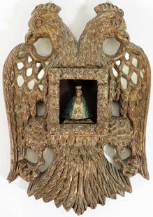 AUSTRIAN WOOD DOUBLE EAGLE RELIGIOUS ICON: A carved gilt wood double eagle with The Virgin Mary in the center and small mirrored accents. Measures 17" x 11.25" x 2". Possibly a Austria-Hungary or Russian Eagle from The Kingdom of Poland. From