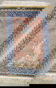 PERSIAN SILK HAND KNOTTED PICTORIAL PRAYER RUG: A Persian Esfahan silk hand knotted pictorial rug with a tiger attacking a large eagle. Measures 26.75" x 40". Signed in Arabic at top and bottom.