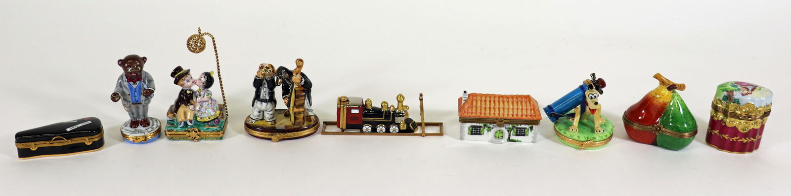 COLLECTION OF 9 LIMOGES TRINKET BOXES: Nine Limoges France Peint Main hand painted trinket boxes to include: a black Violin case with miniature violin inside, two dogs playing instruments marked Sinclair, 12/500, a Wall Street Bear, marked