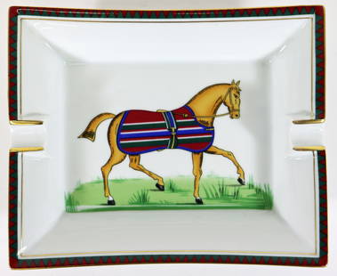 VINTAGE HERMES PORCELAIN EQUESTRIAN HORSE ASHTRAY: A Hermes horse racing ashtray with the horse wearing a red, blue, green and white blanket. Measures 7 1/2" x 6". Marked Hermes Paris - Made in France 346.