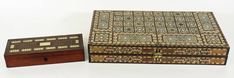 (2) VINTAGE INLAID WOOD BACKGAMMON & CRIBBAGE SET: A Persian inlaid backgammon box with a geometric pattern19.5" x 9.5" x 3" and a inlaid wood cribbage box with 2 sets of South American folk art inspired playing cards. 11" x 3.75" x 2.25"