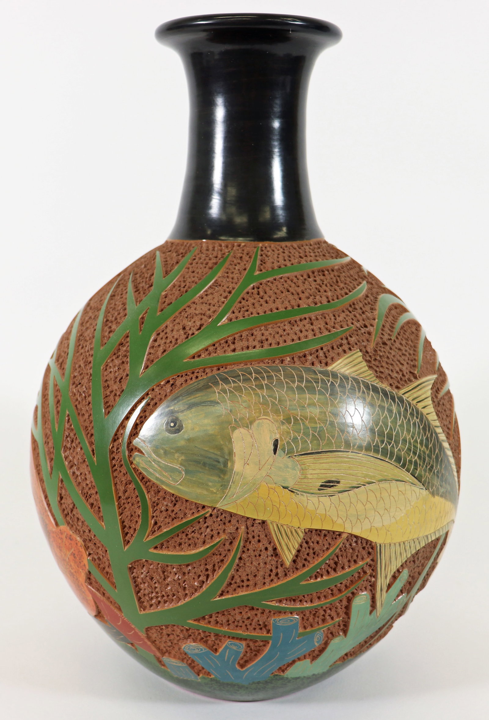 EMMANUEL MALDONADO ART POTTERY FISH VASE: Emmanuel Maldonado (b. 1952) Nicaraguan art pottery vase with fish swimming underwater with plants. Signed on bottom. Measures 14.5" tall 9" wide.
