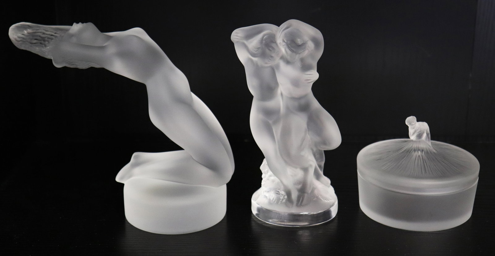LALIQUE MASCOT, FIGURINE, & BOX: Lalique France collection including a 5.5" tall nude mascot, two nude females figurine, and a 1989 Lalique Society trinket box (blemish to inside rim).
