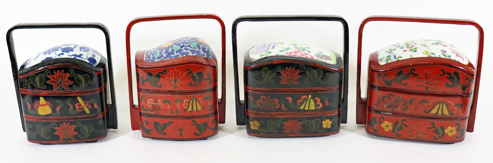 (4) SMALL CHINESE PORCELAIN & LACQUER CONTAINERS: Collection of four antique Chinese porcelain and lacquer wedding baskets (food storage, stacking containers), lacquered and hand painted with porcelain lids. Includes a three tiered red basket with na