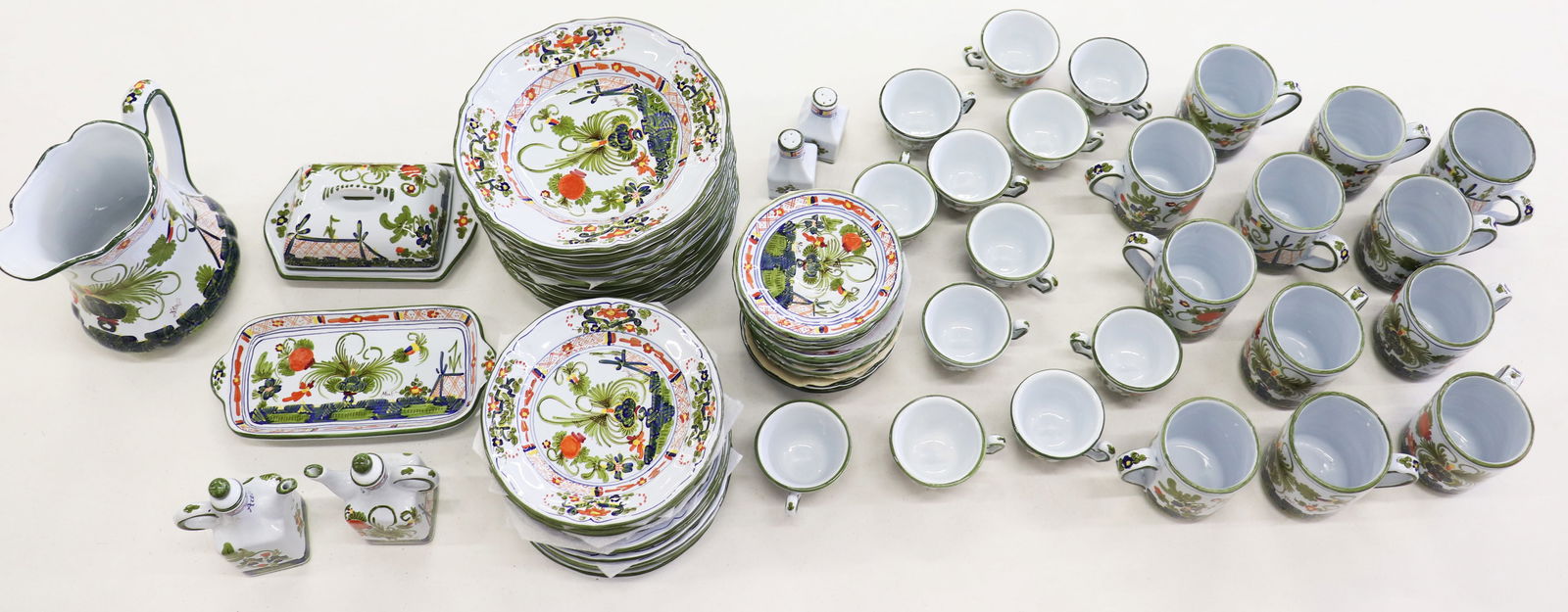 HAND PAINTED B. BROLLI SIGNED ITALIAN CHINA SET: Signed B Brolli (Italy) dinnerware set. Hand painted classic red and yellow flowers, includes (12) mugs, (12) teacups and (12) saucers, (12) salad plates, (12) soup/pasta bowls, (1) covered cheese/but