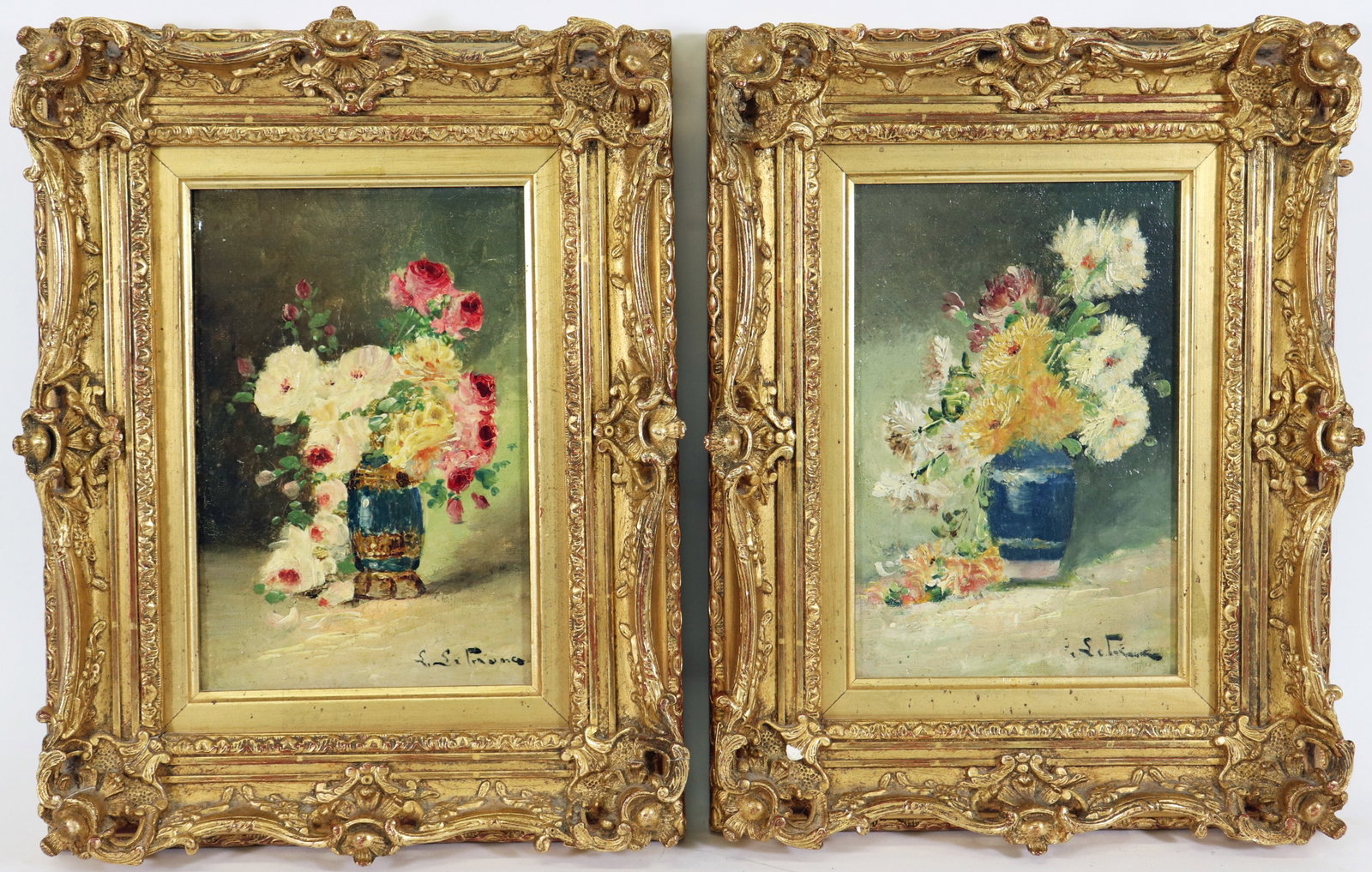 PAIR 19TH CENTURY STILL LIFE FLORAL PAINTINGS: A pair of antique oil on canvas paintings that date to the late 19th early 20th Century. Illegibly signed lower right. Label on verso "J. Desheri, Comptoir Phographique Bellecour, 33 R. Victor Hugo, L