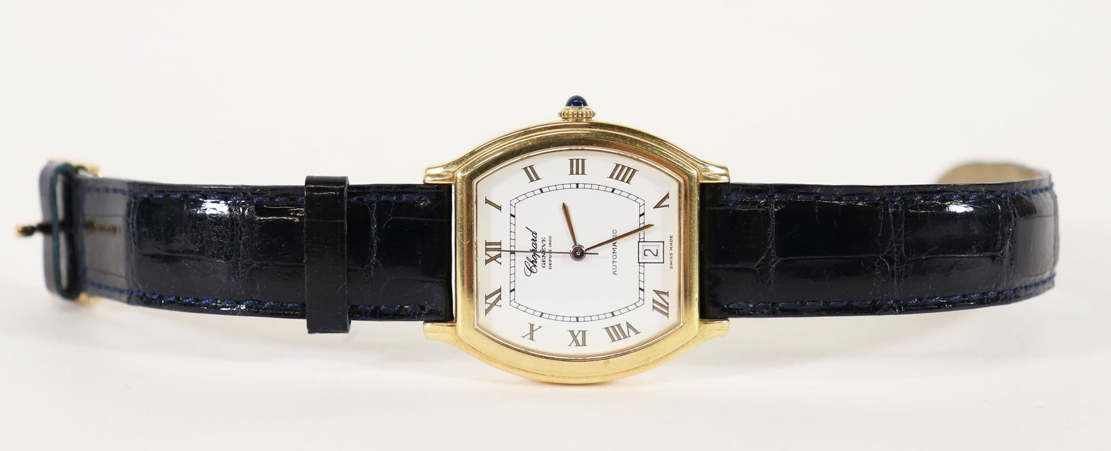 CHOPARD 18K GENEVE DEPUIS 1860 AUTOMATIC WATCH: A men's 18K yellow gold L.U.C. Chopard calendar watch. The dial is marked Geneve 1860 Automatic. Sapphire stem. Case measures approx 32mm x 38mm. The back is stamped Chopard 352971 2247. Original band