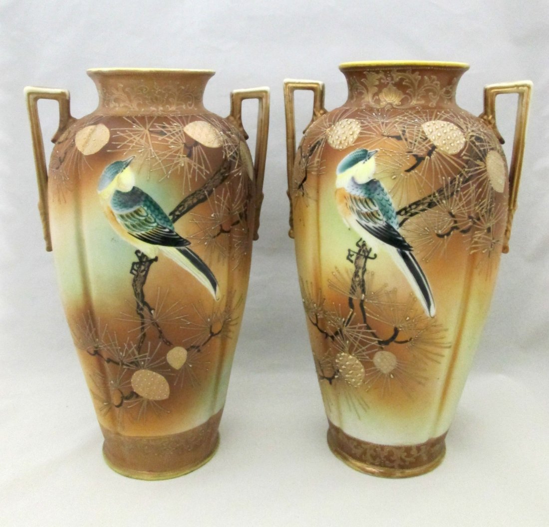 (2) HANDPAINTED NIPPON MORIAGE VASES: Pair of 12" Japanese double handled vases. They feature a blue jay bird on raised gold pinecone branches. It bears the green I. E. & C. Co mark on the base.