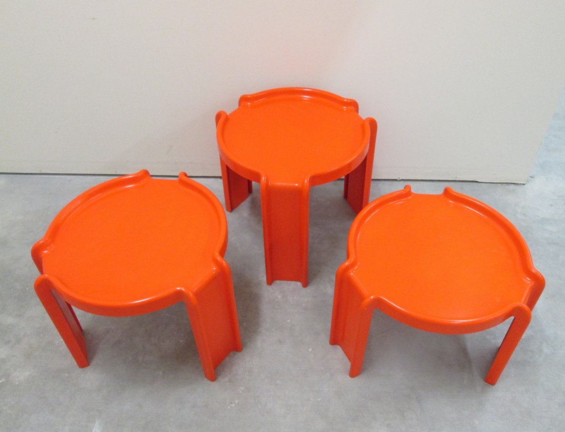 MID CENTURY MODERN GIOTTO STOPPINO TABLES: (3) Stackable tables by Kartell and designer Giotto Stoppino. Orange color, 13" 14 1/2" & 16" tall and 17" wide.
