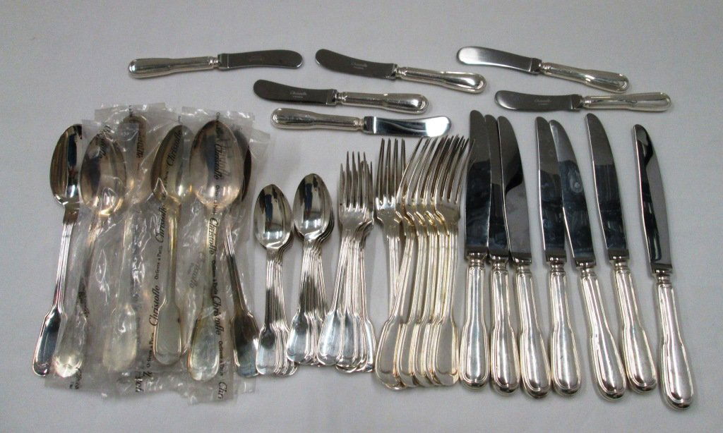 CHRISTOFLE SILVERPLATE FLATWARE: Chinon pattern 48 pieces. (7) Knives, (7) 8" forks, (6) 8" spoons - some unused in plastic, (5) 7 1/2" spoons - some unused in plastic, (11) 5 7/8" spoons, (4) 6 1/2" forks, (6) butter knives, (2) 6 3