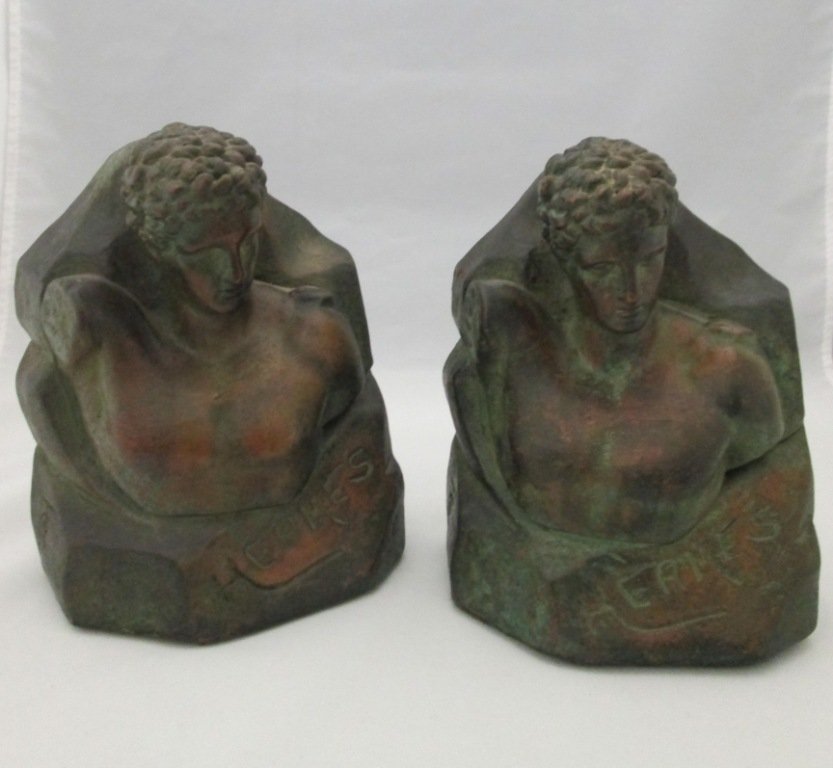 ROMAN BUST HERMES BOOKENDS: Two matching bookends marked Hermes on front of Roman style bust. Side has a signature or hallmark. 7 1/2" tall 6" wide.