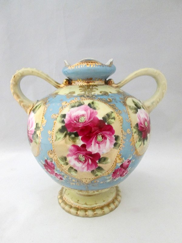 HAND PAINTED NIPPON VASE: Blue with flower design. 7 1/2" tall.