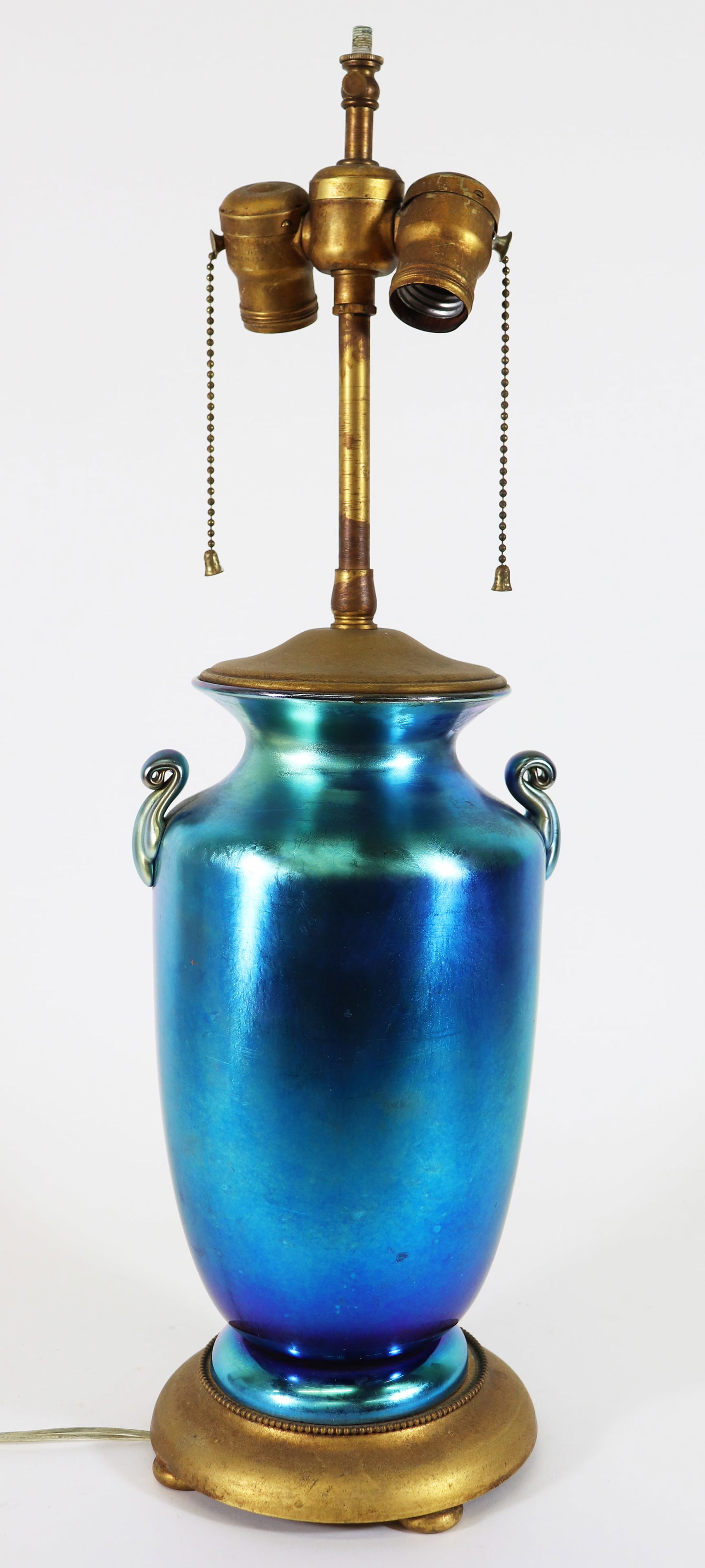 STEUBEN BLUE AURENE TABLE LAMP: Antique Steuben (attributed) blue aurene table lamp with applied handles. Measures 23" tall 7" x 6" wide.