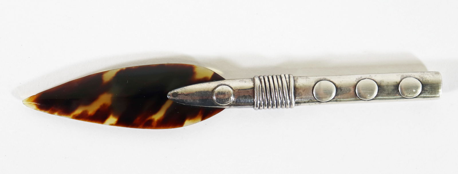 WILLIAM SPRATLING STERLING LETTER OPENER: A vintage letter opener by Mexican silversmith William Spratling and was made between 1951 - 1967. Measures 5.5" x 2.75" x 1"