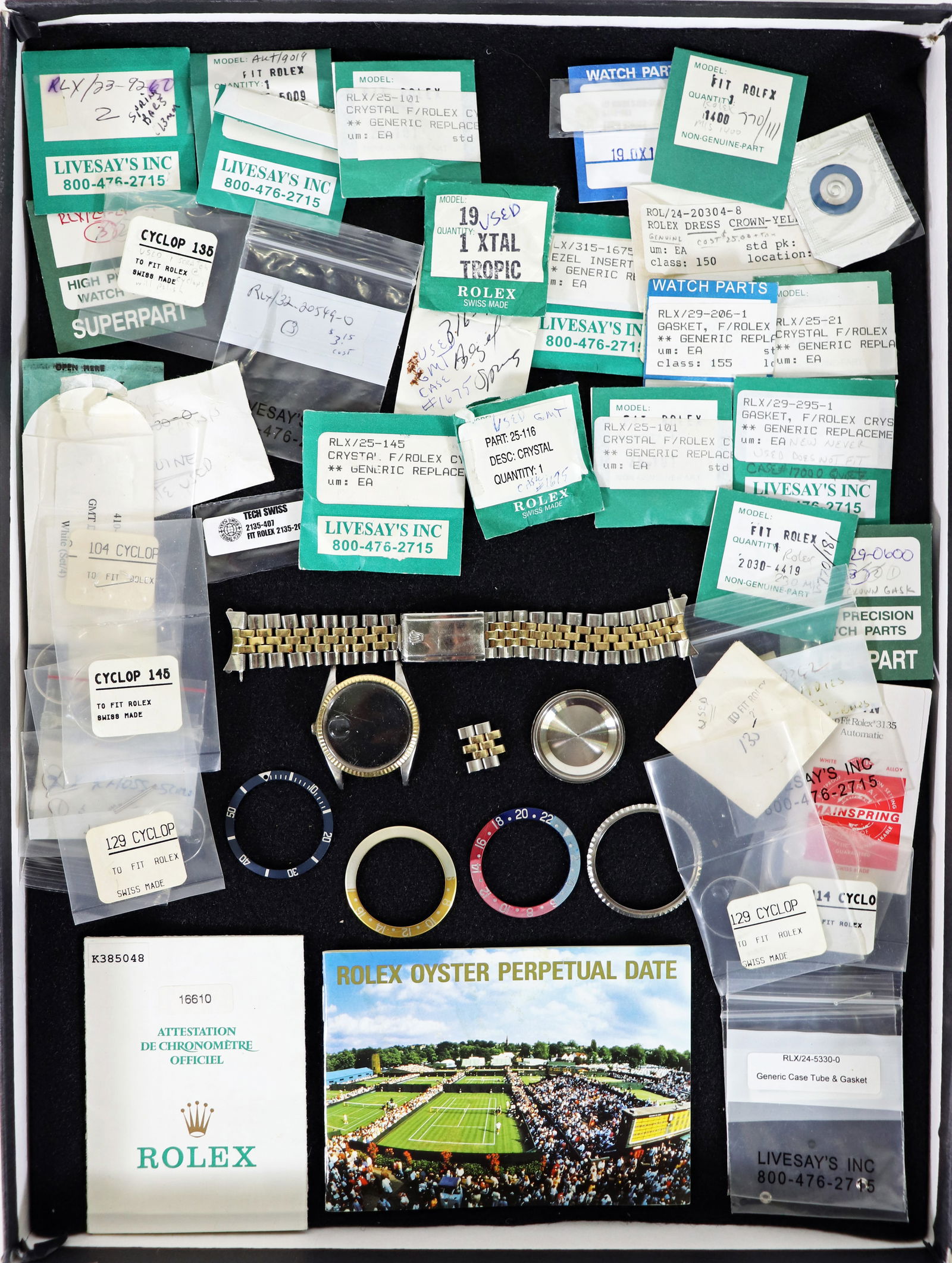 ROLEX WATCH PARTS & MORE: A collection of Rolex parts to include many parts in bags (some Rolex, some generic, bezels and a Rolex watch case and band. Also includes some booklets. Please note, this collection is being sold AS-