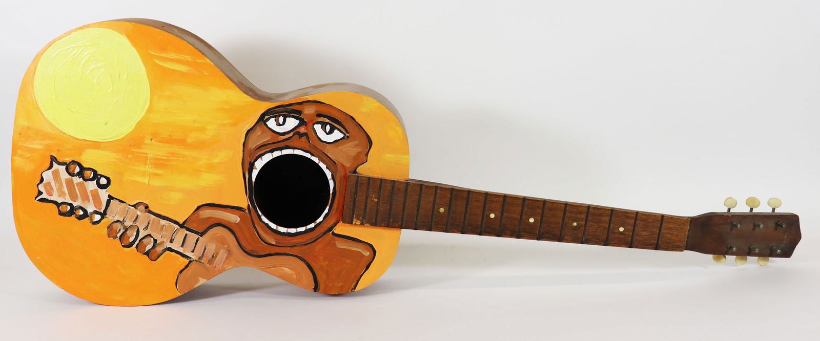 HAND PAINTED ACOUSTIC GUITAR DECOR ART: A unique custom decorated Folk Art guitar, hand painted with orange, yellow and brown, with art decor flair. Measures 38.5" long 13.5" wide.