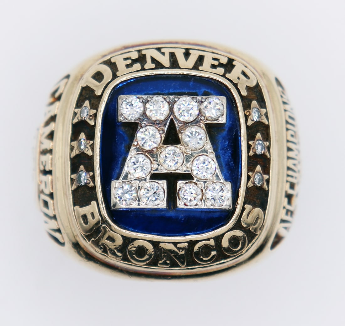 10K DENVER BRONCOS 1986 AFC CHAMPIONSHIP RING: 10K Yellow gold Denver Broncos 1986 AFC Championship ring. Ring features a large "A" in diamonds with blue enamel and (6) stars with round diamonds. The AFC Championship game featured the Denver Bronc