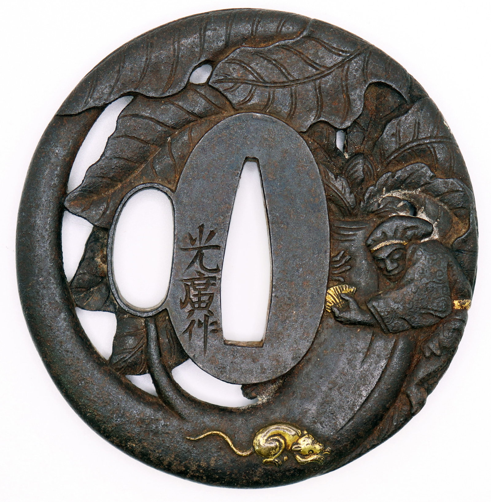 JAPANESE TSUBA WITH FIGURE & RAT: Japanese metal Tsuba sword guard decorated with leaves, a figure, and gold embossed rat. Signed and attributed to Mitsuhiro. Measures 2 3/4". From the Estate of Japanese collector R.W. Lightner.