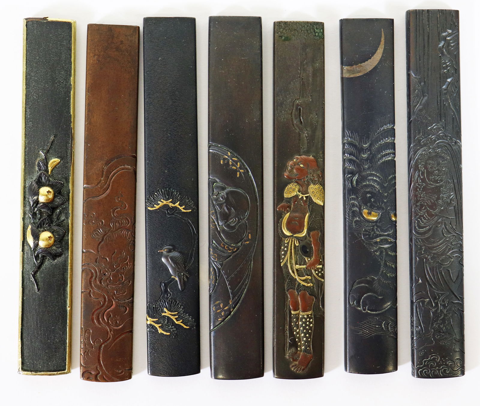 (7) JAPANESE KOZUKA KNIFE HANDLES: Collection of (7) Japanese Kozuka knife handles including mixed metal, bird, tiger, and figures. Some signed. Approximately 3.75" long. From the Estate of Japanese collector Bob Lightner.