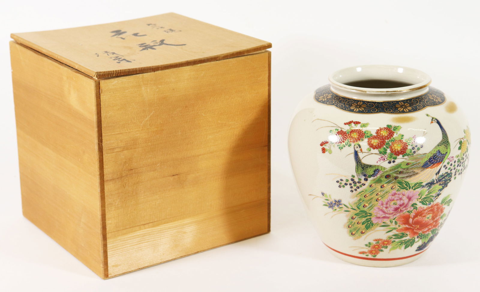 JAPANESE KUTANI VASE IN WOOD BOX: A Kutani vase with a peacock and flowers. Measures 7.5" x 8". Includes Japanese wood box. From the estate of Japanese collector R.W. Bob Lightner.
