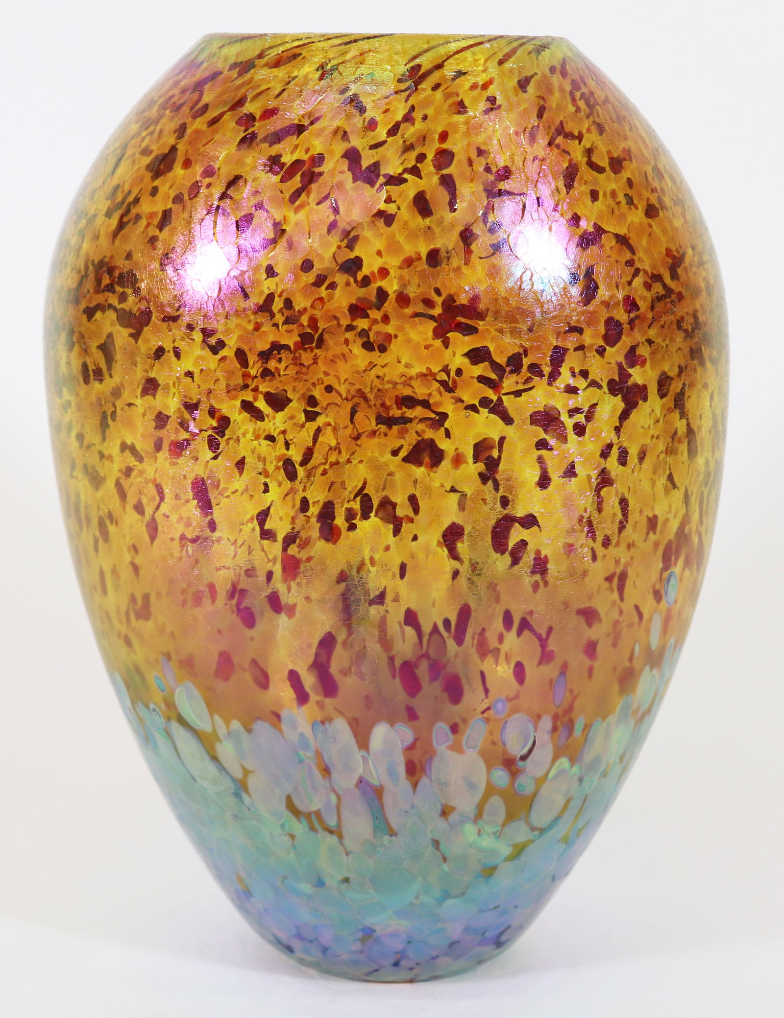 ROBERT EICKHOLT ART GLASS IRIDESCENT VASE 2013: A signed and dated Robert Eickholt studio art glass vase with a iridescent glaze with a speckled finish. Measures 9.75" x 7" x 5". Ships in a 14" x 14" x 14" box