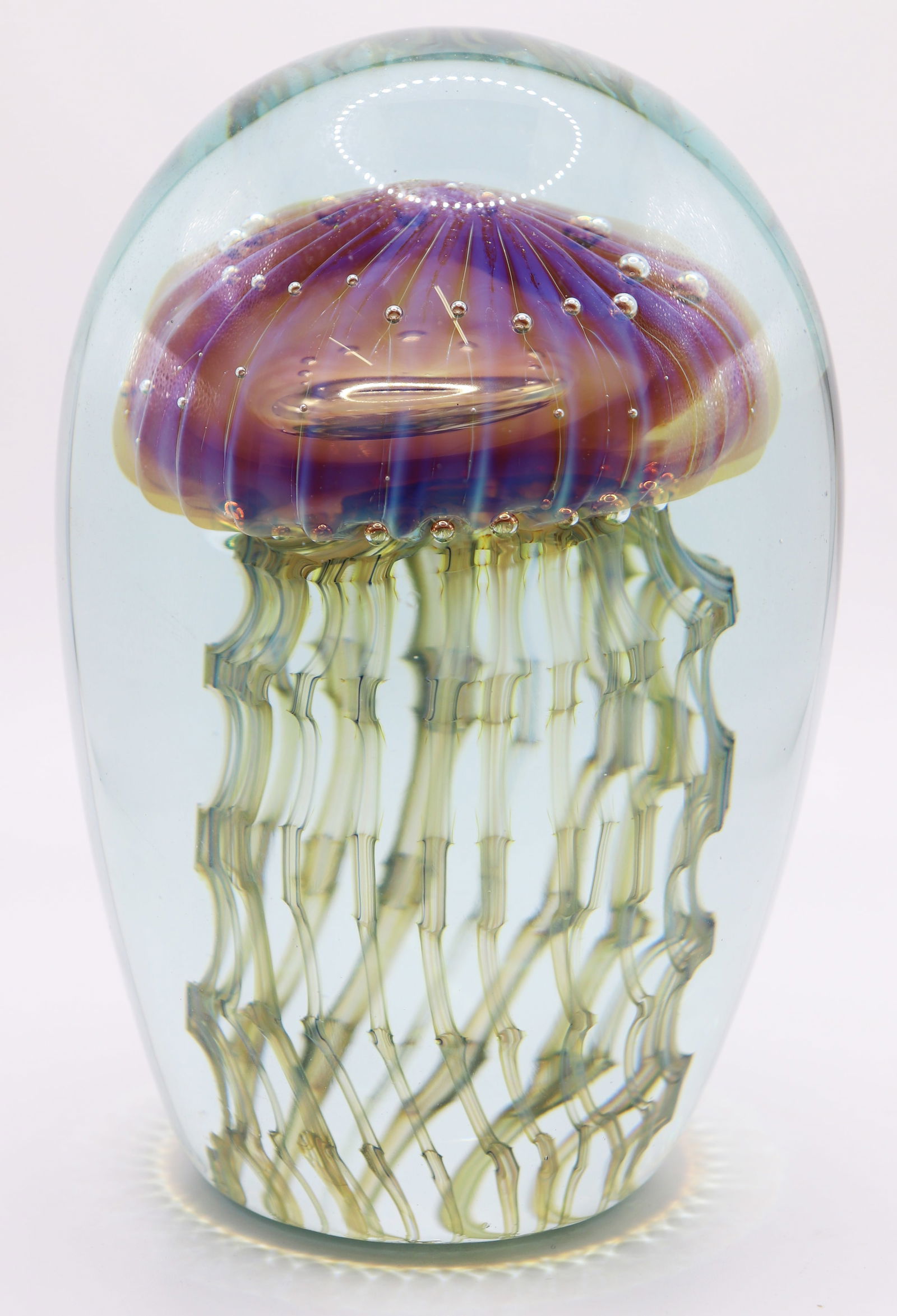 ROBERT EICKHOLT "JELLYFISH" ART GLASS SCULPTURE: Robert Eickholt art glass paperweight sculpture of a jellyfish with a blue top and green tentacles. Signed and dated 2011. Measures 5.75" x 3.5"