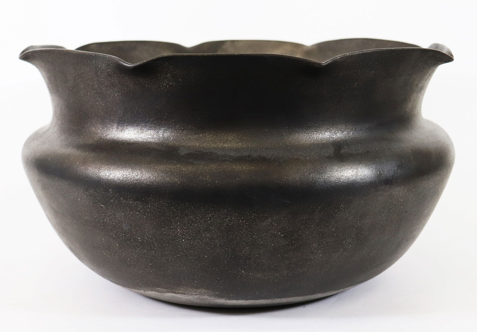 ANGIE YAZZIE ROUND MICACEOUS GRANDMOTHER JAR: Angie Yazzie (b. 1965) Taos Pueblo pottery large round micaceous grandmother jar bowl. Signed on bottom. Measures 16.5" wide 9.5" tall.