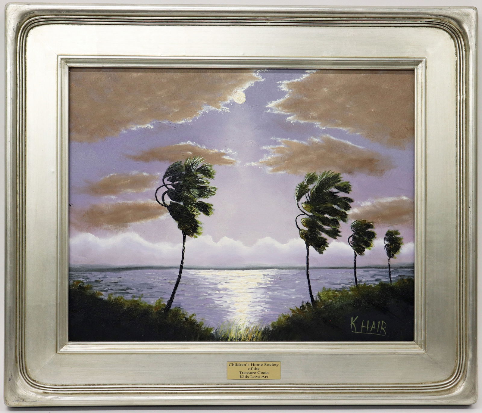 KELVIN HAIR FLORIDA NIGHT RIVER PALMS PAINTING: Kelvin Hair painting of a Florida night landscape with cloudy moonlit sky and palm trees blowing in the wind. Signed lower right. Plaque from Children's Home Society of the Treasure Coast on front of