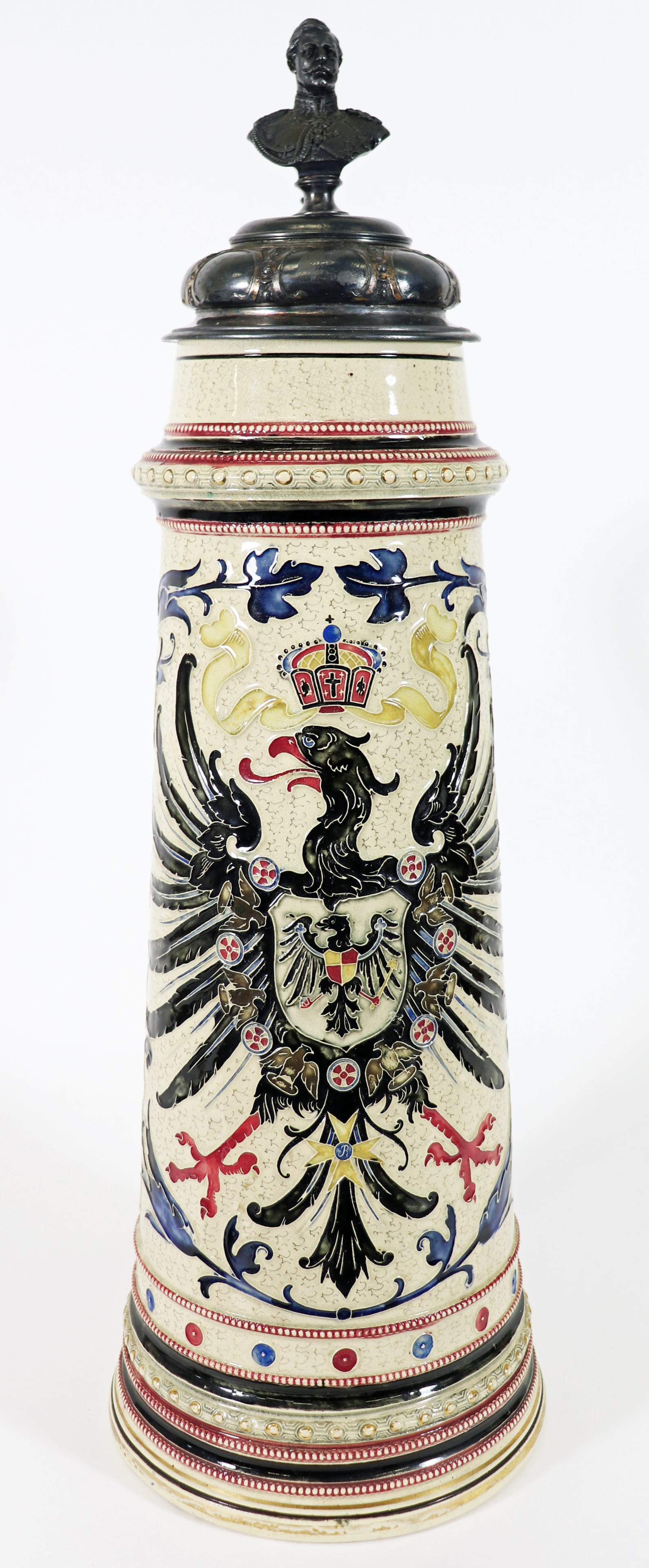 MONUMENTAL GERMAN IMPERIAL EAGLE KAISER STEIN: A large 24" tall beer tankard with a bust of Kaiser Wilhelm II King of Prussia at the top and an ornament on the handle of a globus cruciiger, a Christian symbol of an orb surmounted by a cross. It is