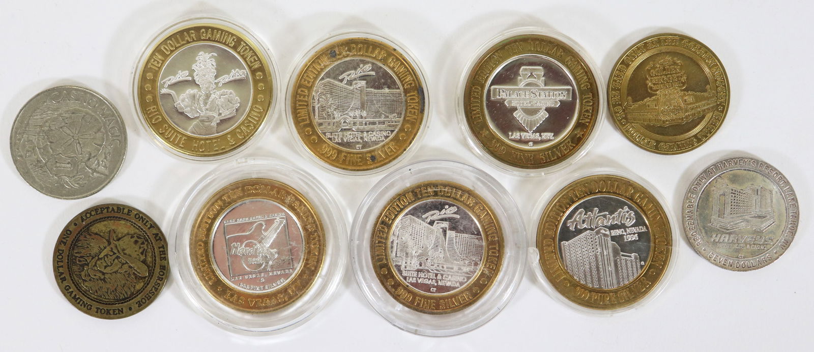 (10) SILVER & MORE CASINO GAMING TOKENS: Collection of (10) casino gaming tokens, some mixed metal with .999 silver, non silver, and a 1992 Harvey's Resort .999 silver token.